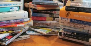 Reading week's first 30 library books.  A few went immediately into the return pile--you can probably pick them out.